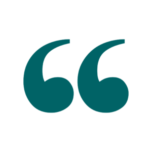 A stylized green quotation mark in a white circle